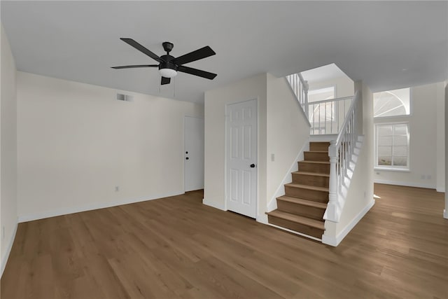 interior space with ceiling fan and hardwood / wood-style flooring