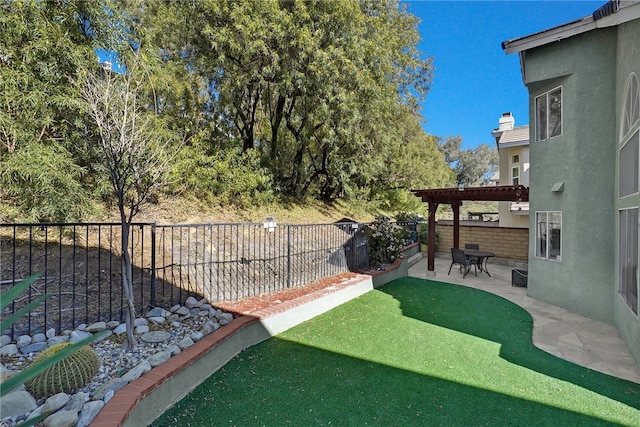 view of yard with a patio area and a pergola