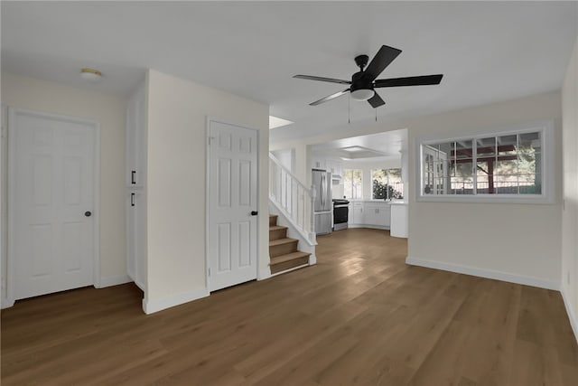 entrance foyer featuring ceiling fan and dark hardwood / wood-style floors