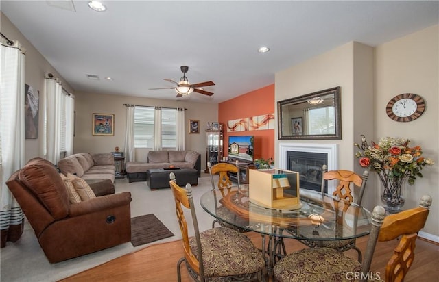 dining room with hardwood / wood-style floors and ceiling fan