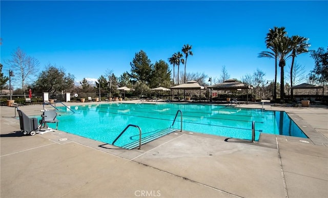 view of swimming pool featuring a gazebo and a patio area