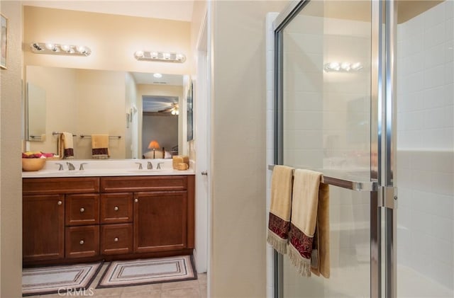 bathroom featuring vanity and a shower with door