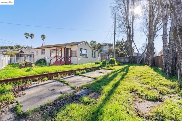 exterior space with a patio and a front yard