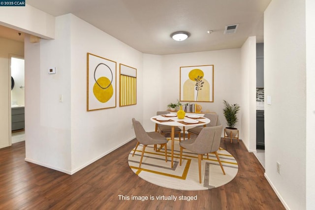 dining area featuring dark hardwood / wood-style flooring