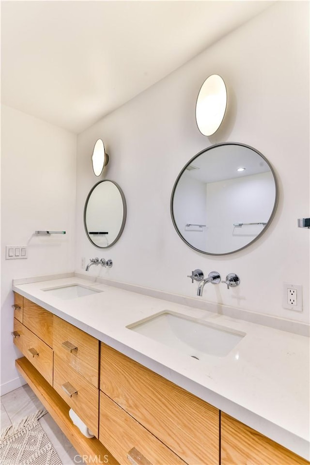 bathroom with vanity and tile patterned floors