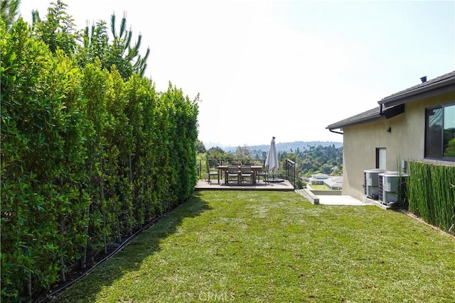 view of yard featuring a patio and cooling unit