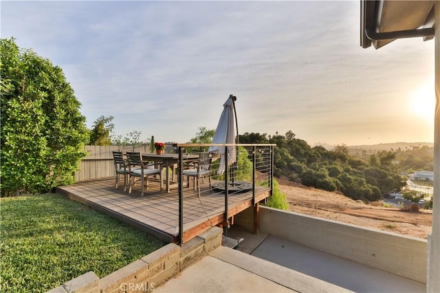 deck at dusk with a yard