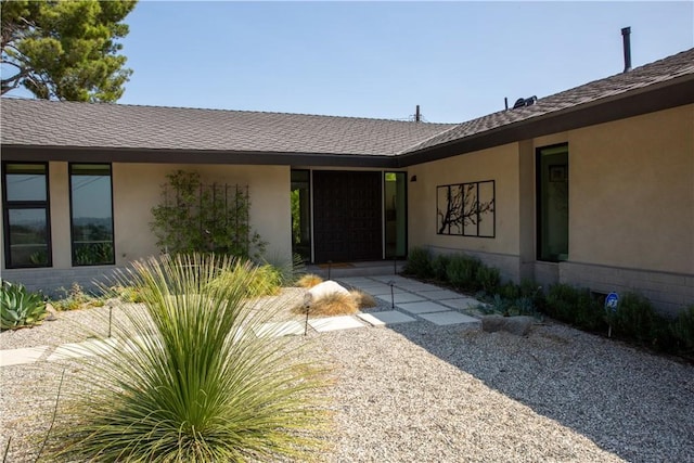 doorway to property with a patio area