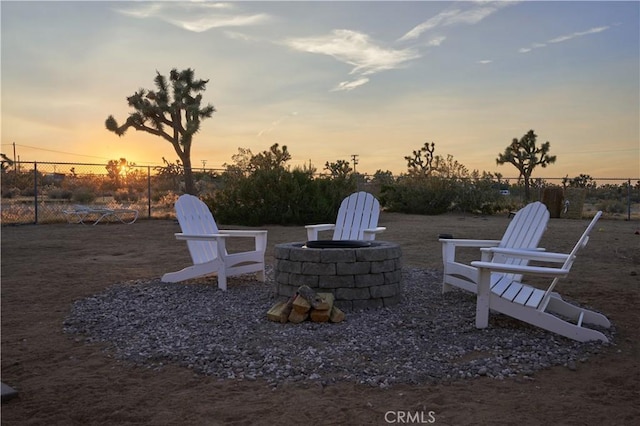 patio terrace at dusk with an outdoor fire pit