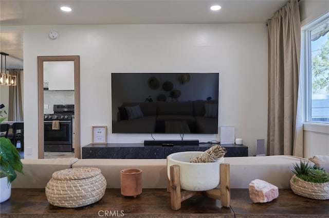 living room featuring a chandelier and hardwood / wood-style floors