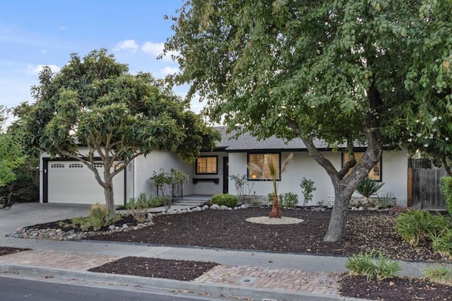 single story home featuring a garage