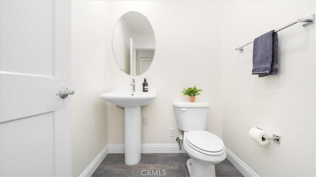 bathroom with toilet and sink