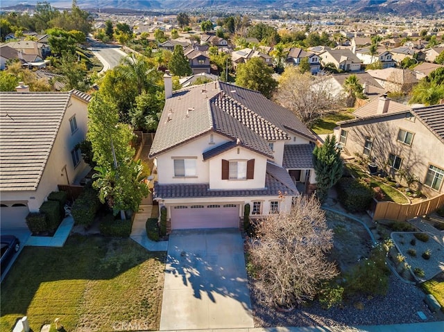 birds eye view of property with a mountain view