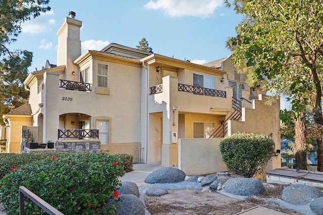 view of front of home with a balcony