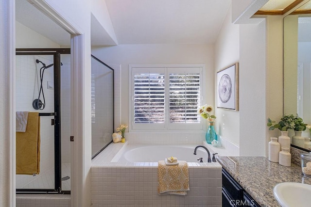 bathroom featuring independent shower and bath and vanity