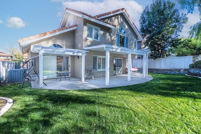 rear view of house with central AC, a yard, a pergola, and a patio