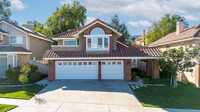 view of front facade with a front lawn and a garage