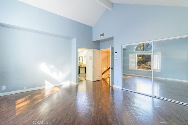 unfurnished bedroom with high vaulted ceiling, a closet, beamed ceiling, and dark hardwood / wood-style floors