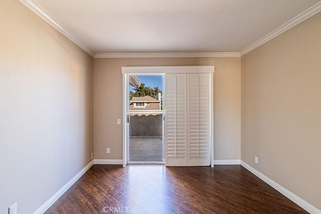 unfurnished room featuring crown molding and dark hardwood / wood-style floors