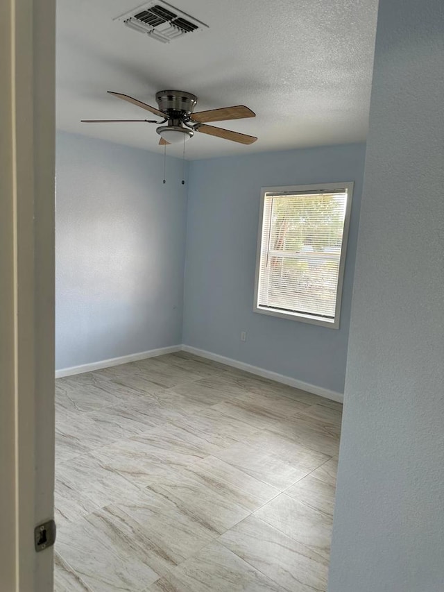 empty room with ceiling fan