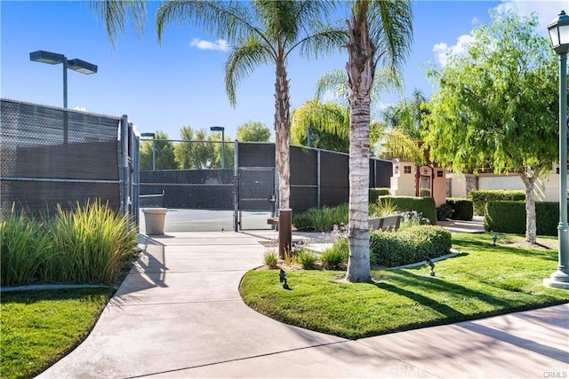 surrounding community featuring tennis court