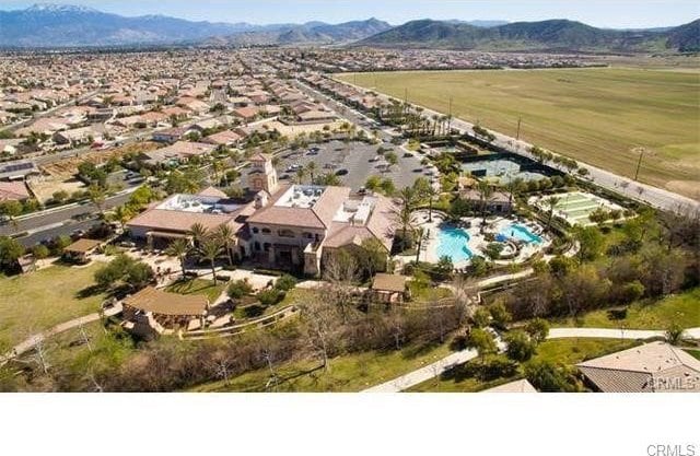 birds eye view of property featuring a mountain view