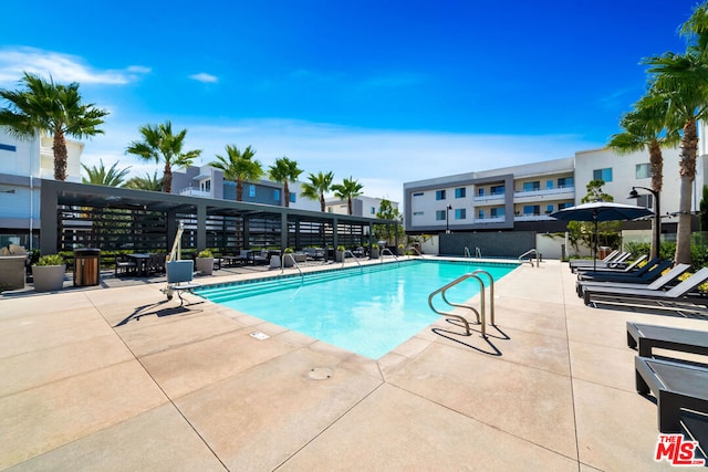 view of swimming pool featuring a patio area