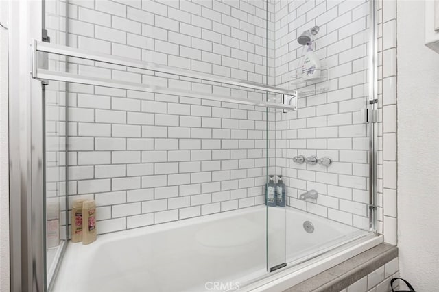 bathroom featuring enclosed tub / shower combo