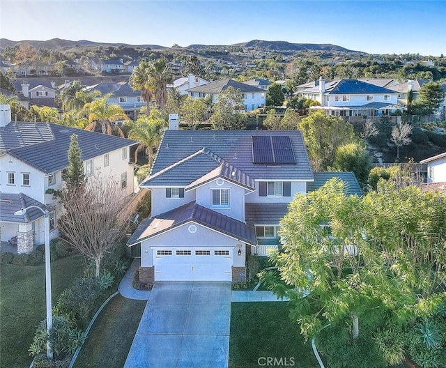 birds eye view of property featuring a mountain view