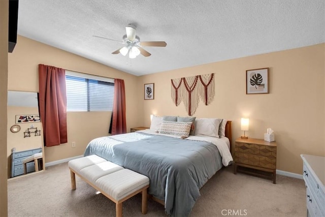 carpeted bedroom with a textured ceiling and ceiling fan