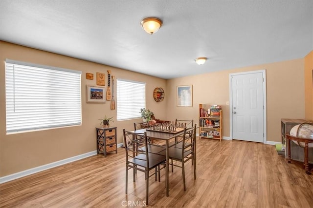 dining area with light wood-type flooring