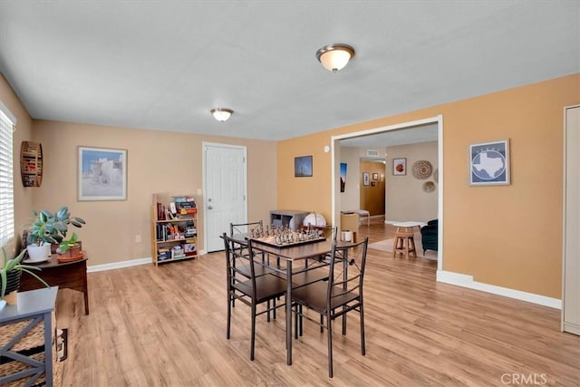 dining room with light hardwood / wood-style flooring