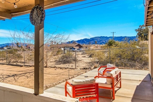 view of patio / terrace featuring a mountain view