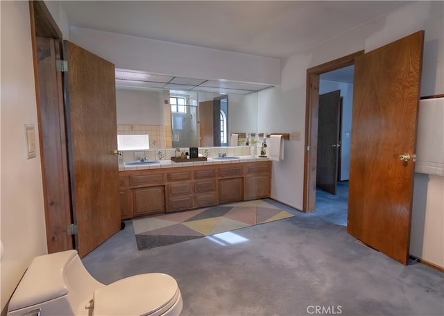 bathroom with backsplash and vanity