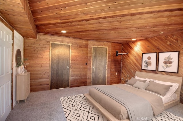 unfurnished bedroom with wood ceiling, wooden walls, and light colored carpet