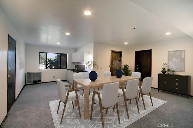 dining area featuring light carpet