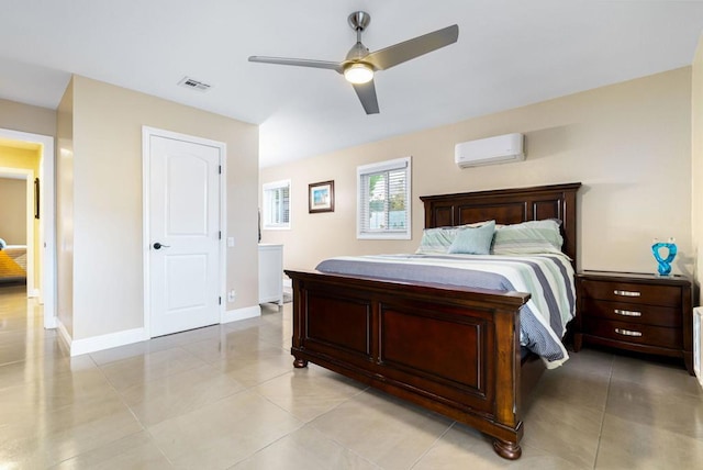 tiled bedroom with an AC wall unit and ceiling fan