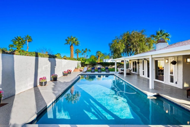 view of swimming pool with a patio