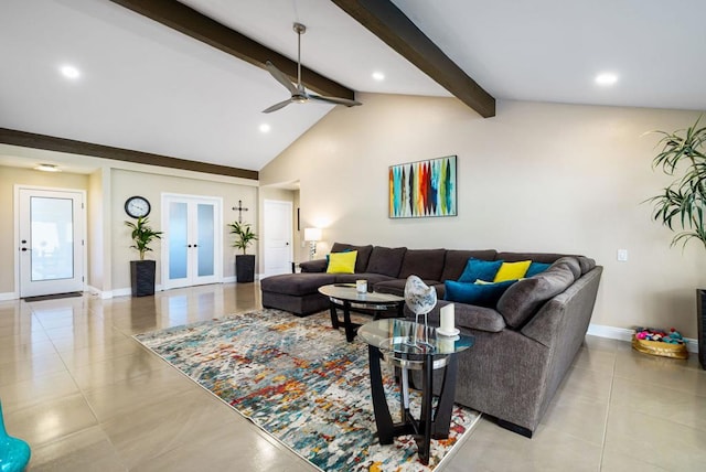 tiled living room with french doors, lofted ceiling with beams, and ceiling fan