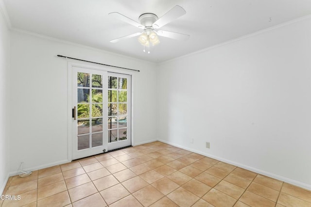 tiled spare room with crown molding and ceiling fan