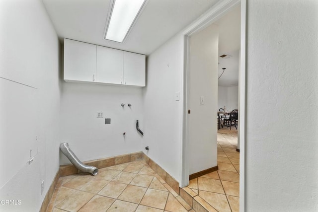 laundry room featuring hookup for a gas dryer, hookup for a washing machine, cabinets, and light tile patterned flooring