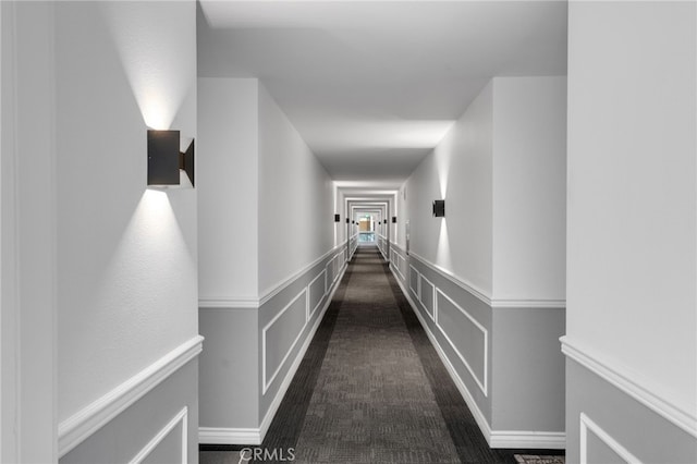 hallway with dark carpet