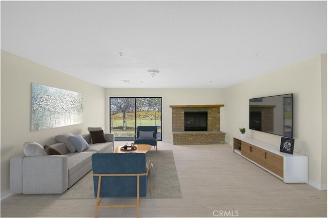 living room with a brick fireplace