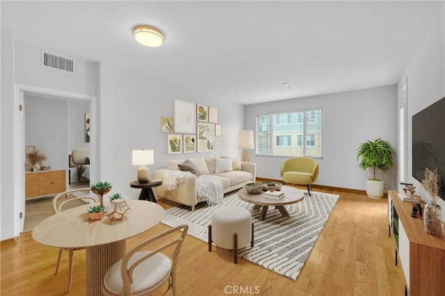 living room with light hardwood / wood-style flooring