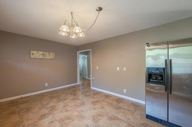 unfurnished dining area with a chandelier