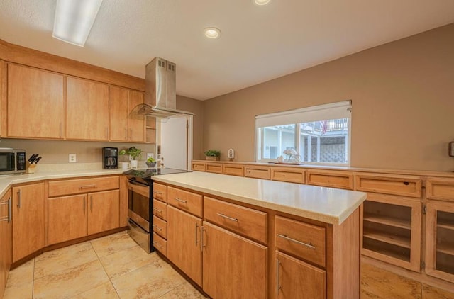 kitchen with appliances with stainless steel finishes and island exhaust hood