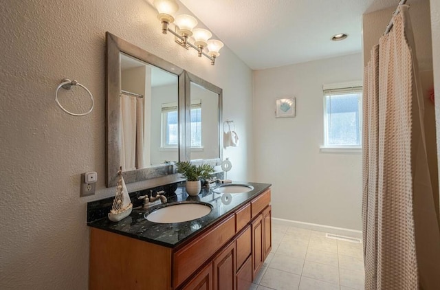 bathroom featuring vanity and tile patterned flooring