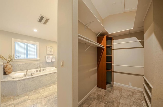 spacious closet featuring lofted ceiling