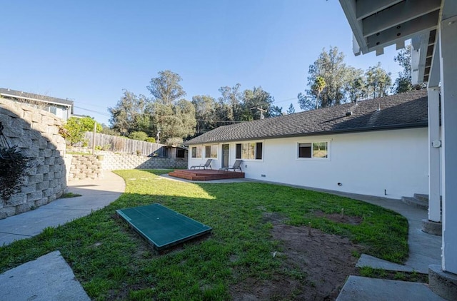 view of yard with a wooden deck