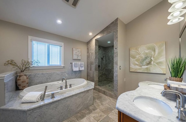 bathroom with independent shower and bath, lofted ceiling, and vanity